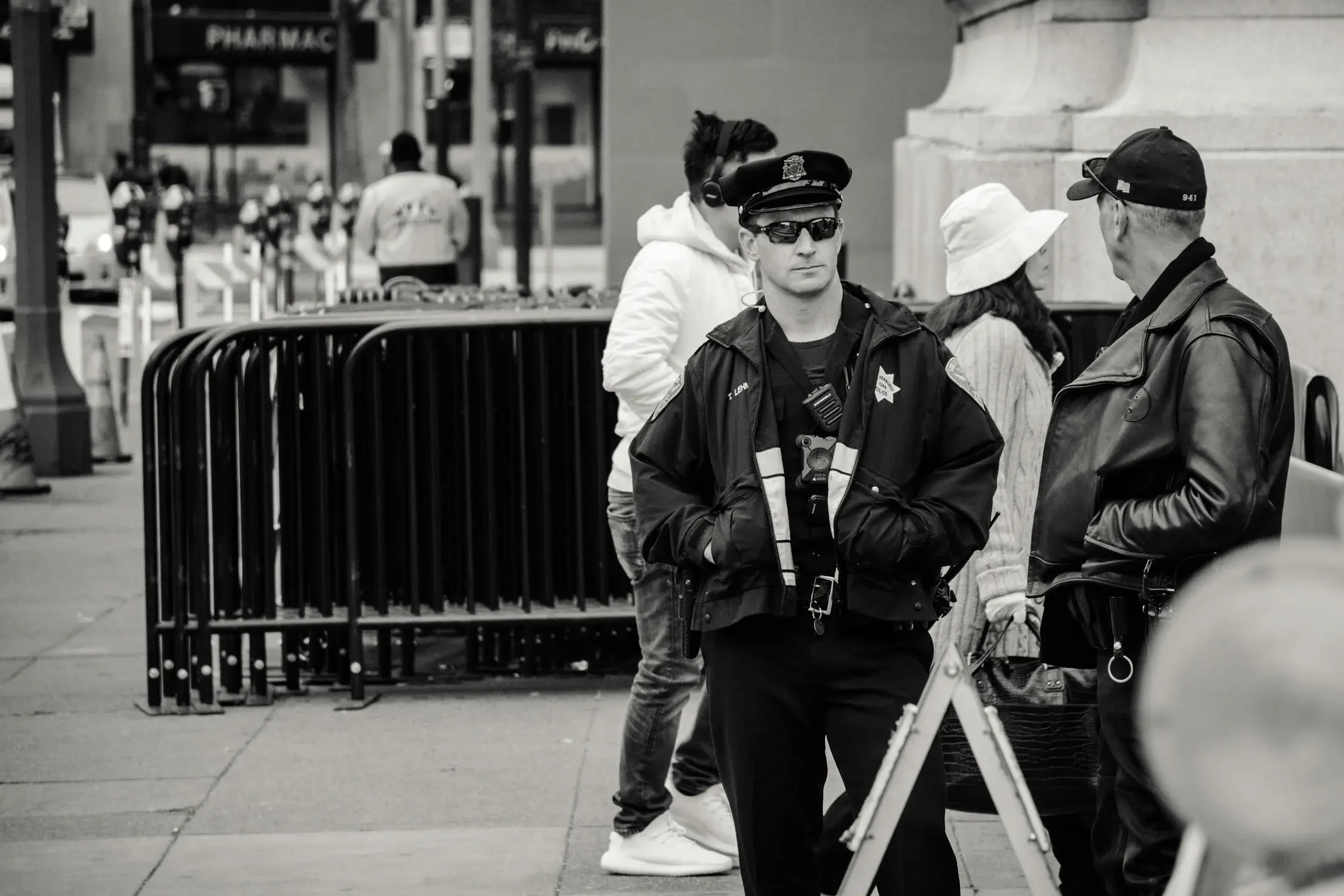 Police officer standing on duty in a city environment, engaging with the public